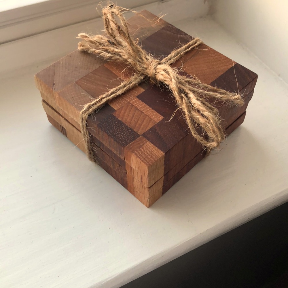 New! 4 wood coasters, raffia tie. Makes nice gift!